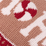 Close-up of the Candy Ho Ho Ho tufted cushion showing a red and white peppermint swirl motif with "Ho" lettering on a blush pink cotton ground.