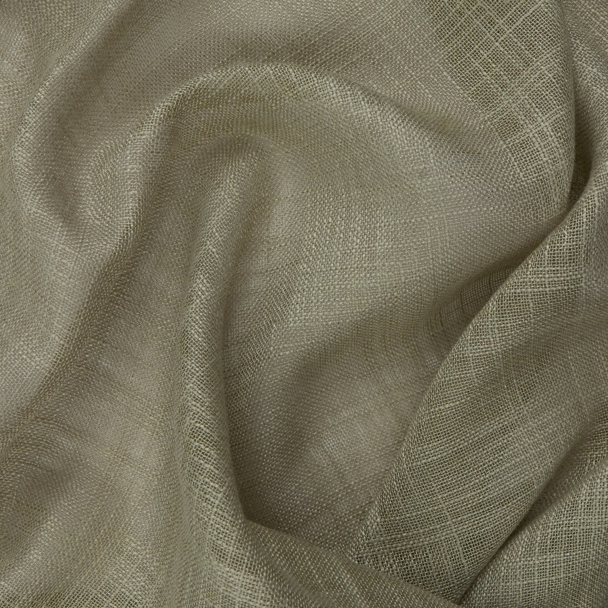 Close-up of the Cirrus sheer curtain panel in eucalyptus, showing its slubbed, cross-hatched polyester weave in a soft greyed-green tone.