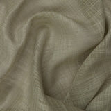Close-up of the Cirrus sheer curtain panel in eucalyptus, showing its slubbed, cross-hatched polyester weave in a soft greyed-green tone.