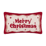 Rectangular tufted cotton cushion in cream with a red "Merry Christmas" script and a wavy red and pink border, hooked pile texture, shown on a plain white background.