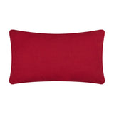 Rectangular Candy Merry Christmas cushion shown reverse side in plain red cotton fabric with piped edges, photographed on a plain white background.