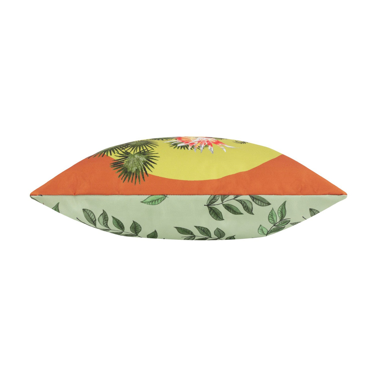 Side view of the Cockatoo Reversible Polyester Cushion showing tropical foliage on a yellow and orange ground reversing to a green leaf-print side, on a white background.