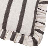 Close-up corner of the Connie striped linen cushion in chocolate, showing cream fabric with brown stripes and a gathered ruffle edge.