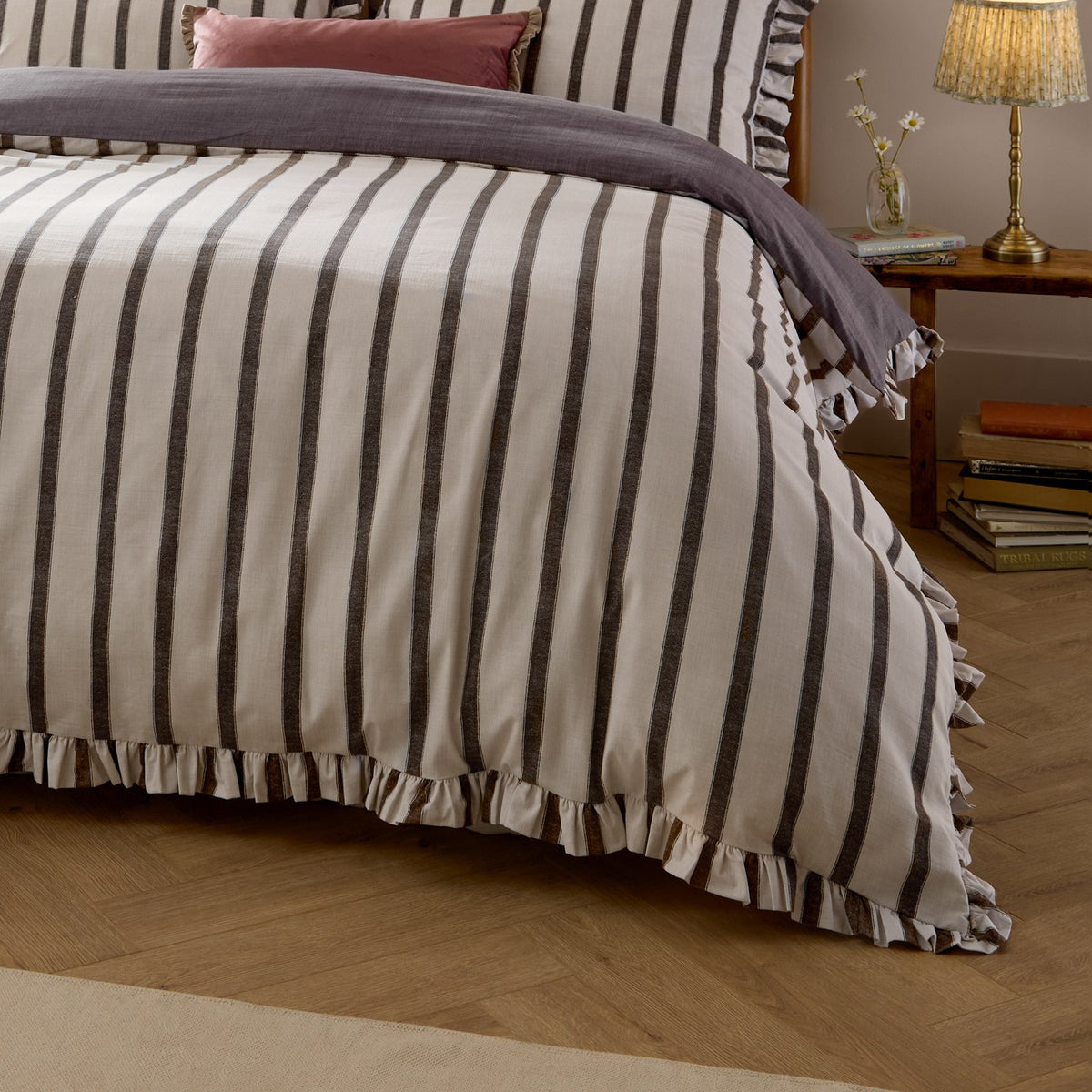 Connie Linen Plain Duvet Cover Set in Chocolate, a cream and dark brown striped cotton-blend duvet with ruffled edge trim, shown on a bed in a bedroom setting.