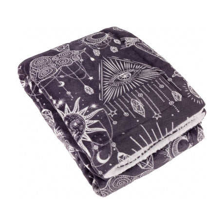 Folded Constellation Printed Polyester Throw in charcoal with cream celestial line-work of suns, moons, stars and eyes, sherpa reverse visible, on a white background.