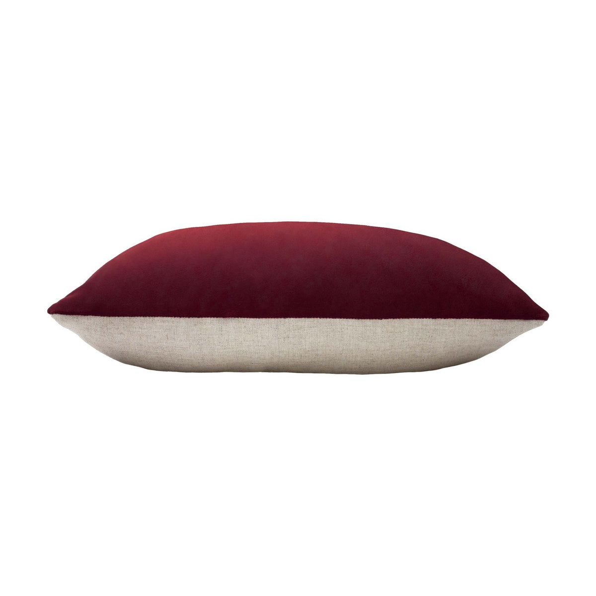 Contra Velvet Linen Cushion in oxblood, an oblong bolster-style cushion with deep red velvet front and neutral linen-look reverse, shown side-on against a white background.