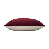 Contra Velvet Linen Cushion in oxblood, an oblong bolster-style cushion with deep red velvet front and neutral linen-look reverse, shown side-on against a white background.