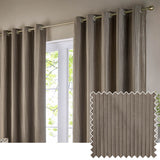 Corinthian velvet lined eyelet curtains in taupe, hung on a brass pole beside a window, with fine vertical pleats and a fabric swatch shown inset.