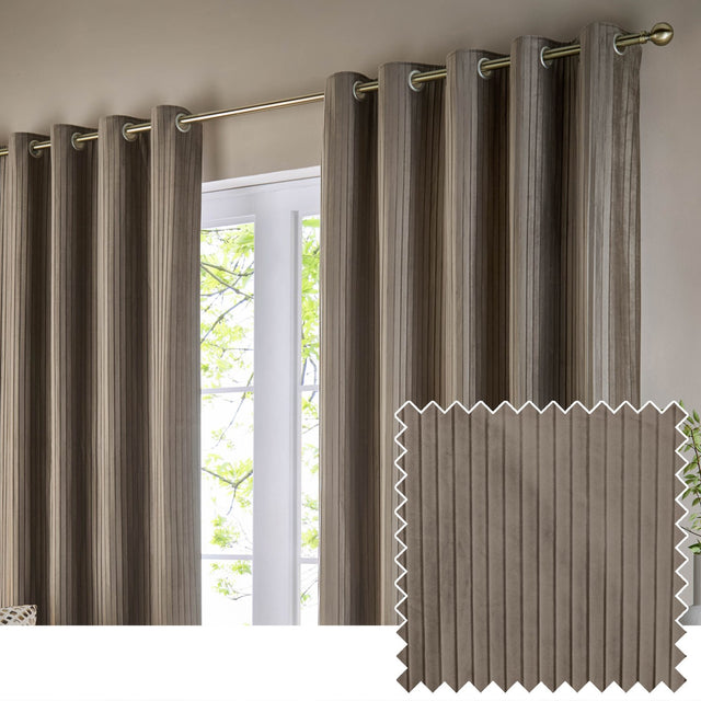Corinthian velvet lined eyelet curtains in taupe, hung on a brass pole beside a window, with fine vertical pleats and a fabric swatch shown inset.