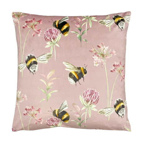 Country Animal Velvet Cushion in heather pink, 43 x 43cm, printed with bumble bees, clover and flowering stems on a soft velvet ground, shown on a plain white background.