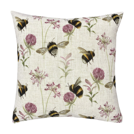 Square 43 x 43cm linen-look cushion printed with bumblebees in flight among pink clover heads and green flowering stems on a cream ground, shown against a plain white background.