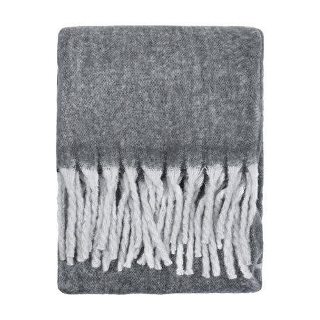Cosy Plain Polyester Throw in charcoal grey, folded flat with a deep white tasselled fringe along the short ends, shown on a plain white background.