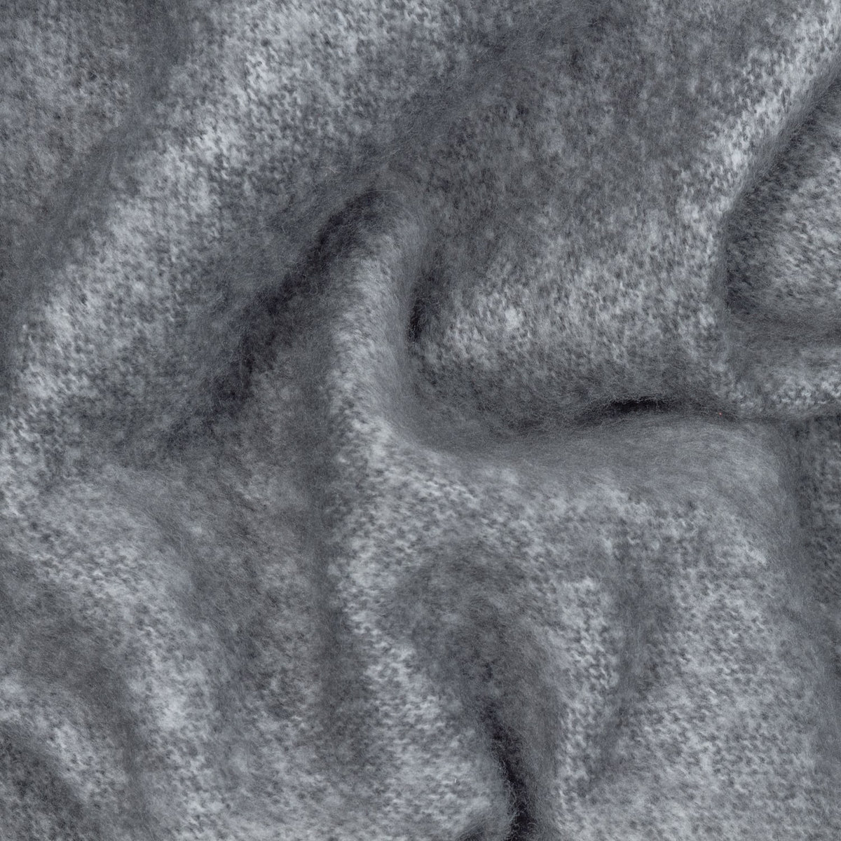Close-up of the Cosy Plain Polyester Throw in charcoal grey, showing the soft woven texture and folds of the fabric surface.