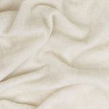 Cosy Plain Polyester Throw in ecru, shown draped in soft folds showing a brushed, hazy woven texture in warm cream tones.