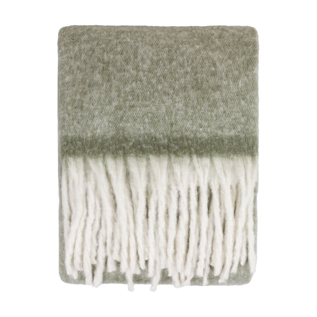 Cosy Plain Polyester Throw in Green, folded to show a soft sage woven body with knotted ivory fringe trim, shown on a plain white background.