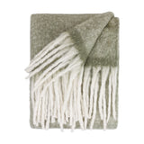Cosy Plain Polyester Throw in Green, folded on a white background, showing a soft sage-green woven body with chunky ivory fringed trim along the short ends.