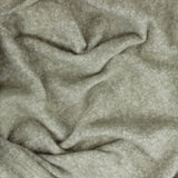 Cosy Plain Polyester Throw in sage green, shown draped and gathered to reveal its soft woven texture with subtle tonal shading.
