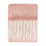 Cosy Plain Polyester Throw in blush pink, folded flat with a brushed, hazy surface fading to cream and finished with chunky ivory fringe, shown on a white background.