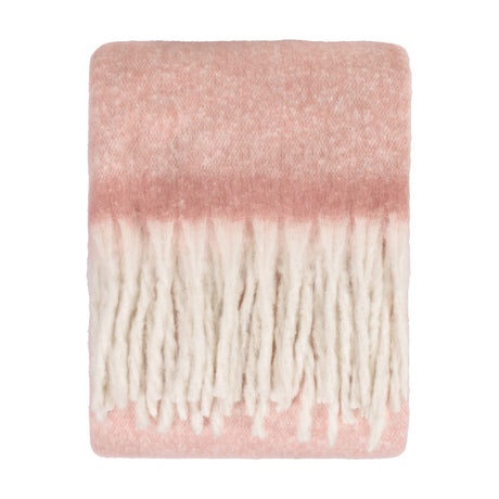 Cosy Plain Polyester Throw in blush pink, folded flat with a brushed, hazy surface fading to cream and finished with chunky ivory fringe, shown on a white background.