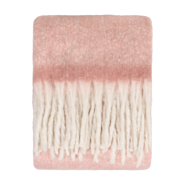 Cosy Plain Polyester Throw in blush pink, folded flat with a brushed, hazy surface fading to cream and finished with chunky ivory fringe, shown on a white background.