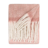 Cosy Plain Polyester Throw in Pink, folded on a white background, showing a brushed blush pink body fading to cream with chunky ivory fringe along the edge.