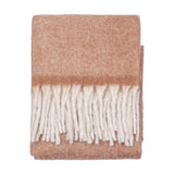 Cosy Plain Polyester Throw in rust, folded to show a woven texture with cream knotted fringe tassels, set against a plain white background.