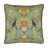 Chatsworth Peacock Velvet Linen Cushion in sage green, featuring a symmetrical design of two peacocks and yellow buntings flanking a floral urn, on a plain white background.