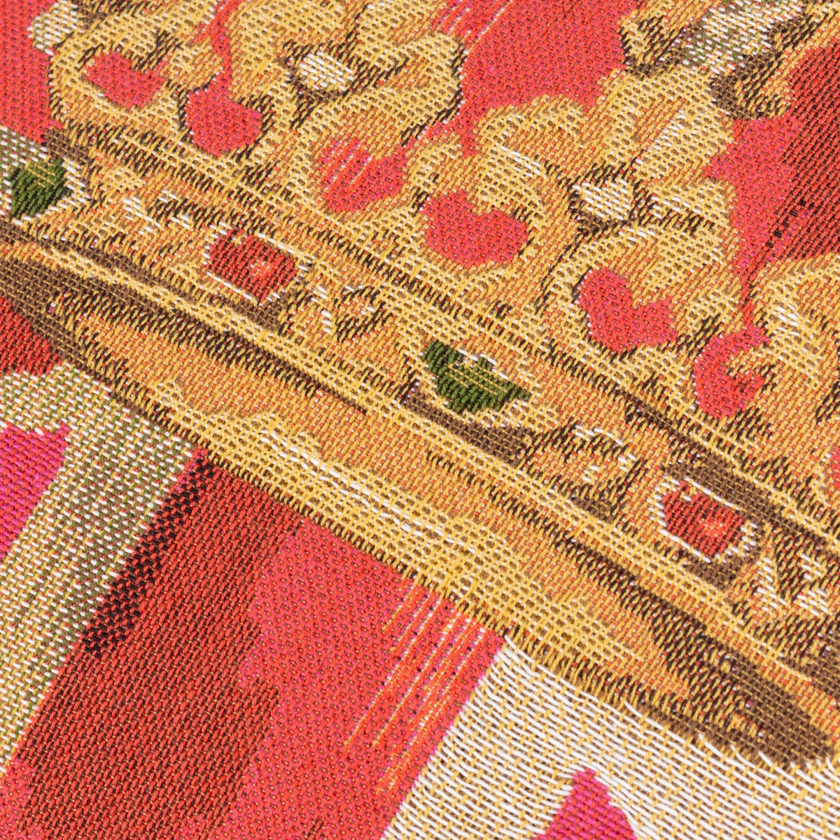 Close-up of the Crown Union Jack Plain Cotton Cushion in pink, showing woven cotton fabric with a gold crown motif and coral, pink and cream tones.