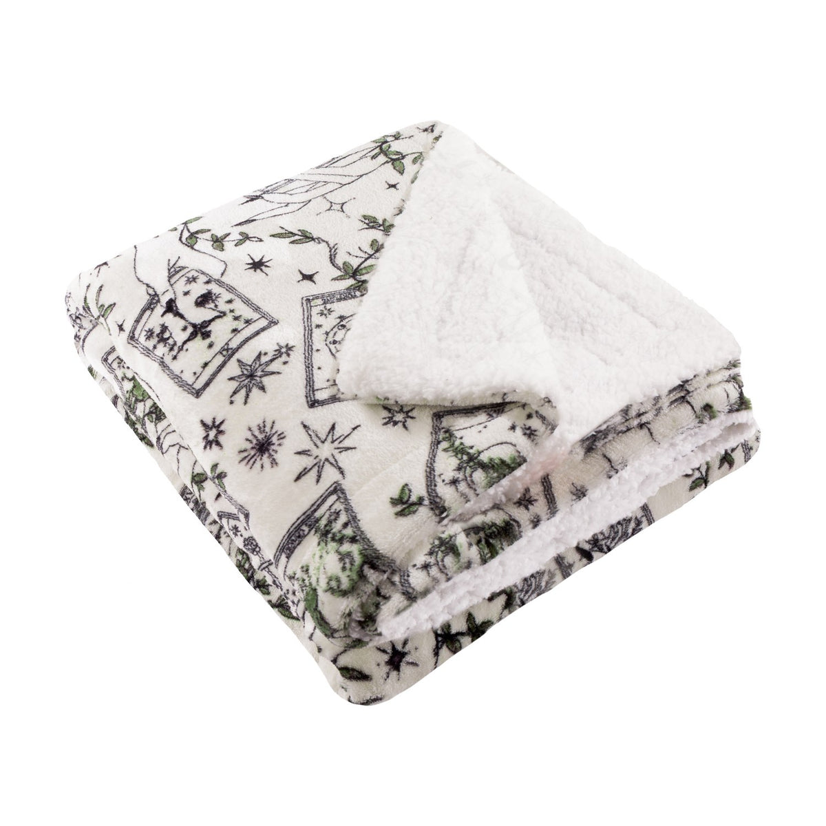 Folded Celestial Stories throw in cream with charcoal tarot card, star and moon print and green foliage detail, reverse sherpa lining visible, on a plain white background.