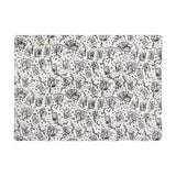 Celestial Stories printed polyester throw in cream, featuring charcoal tarot card, hand, star, moon and leaf motifs with green foliage accents, shown flat on a plain background.