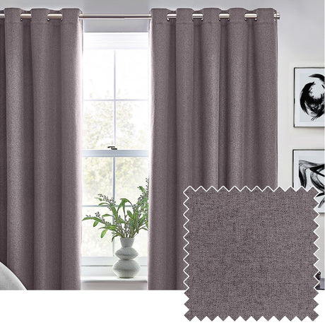 Dawn Plain Reversible Eyelet Curtains in charcoal grey hanging by a window, shown with a matching fabric swatch featuring a subtle marl texture.