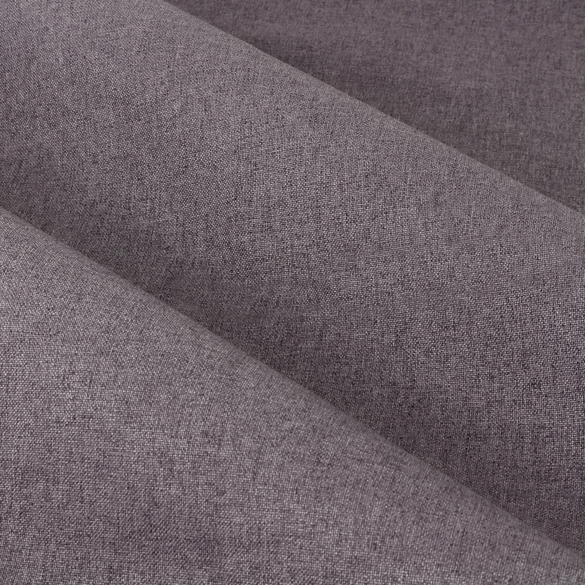 Close-up of Dawn Plain Reversible Eyelet Curtains in charcoal, showing the soft-textured woven polyester fabric with a subtle marl effect and gentle folds.