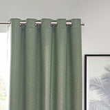 Dawn Plain Reversible Eyelet Curtains in Eucalyptus, dusty green marl-effect fabric with silver eyelet grommets on a metal pole, shown against a light wall near a framed print.