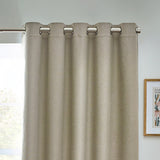 Dawn Plain Reversible Eyelet Curtains in natural marl fabric with brushed metal eyelet rings, shown hanging from a pole in a room setting.