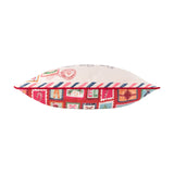 Side view of the Dear Santa Velvet Cotton Cushion, showing cream airmail-style top with red-pink-navy stripes and a red base panel with colourful stamp motifs, on a white background.
