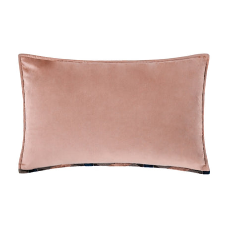Delano Jacquard Velvet Cushion in blush pink with plain velvet reverse and piped edges, patterned navy jacquard trim peeking along the base seam, shown on a white background.