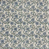 Delphine Floral Cotton Throw in Delph Blue, showing an all-over scattered floral pattern in dusty blue and green on a cream cotton ground with a loosely woven texture.