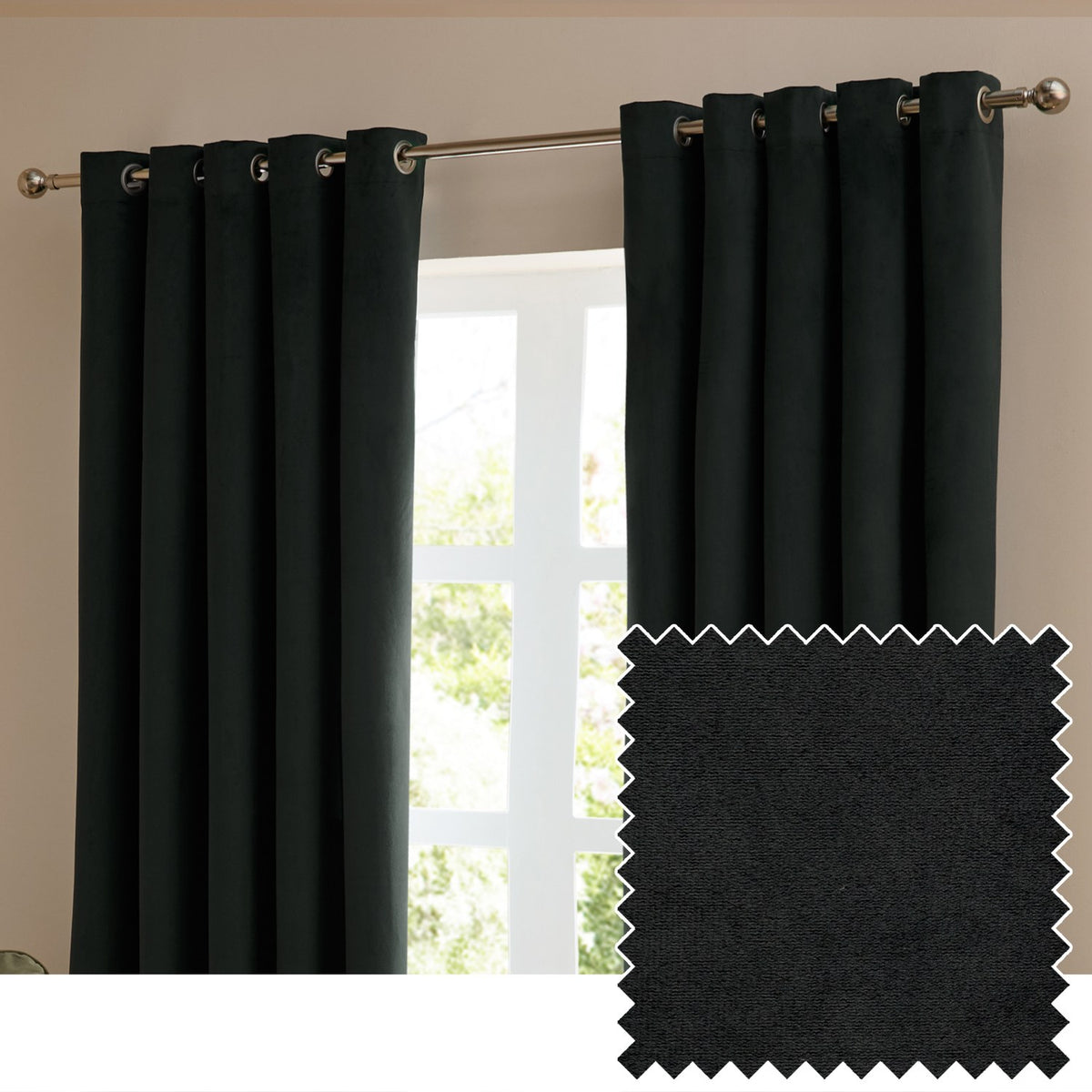 Black velvet eyelet curtains hung on a brushed metal pole beside a window, shown with a fabric swatch highlighting the soft matt pile texture.