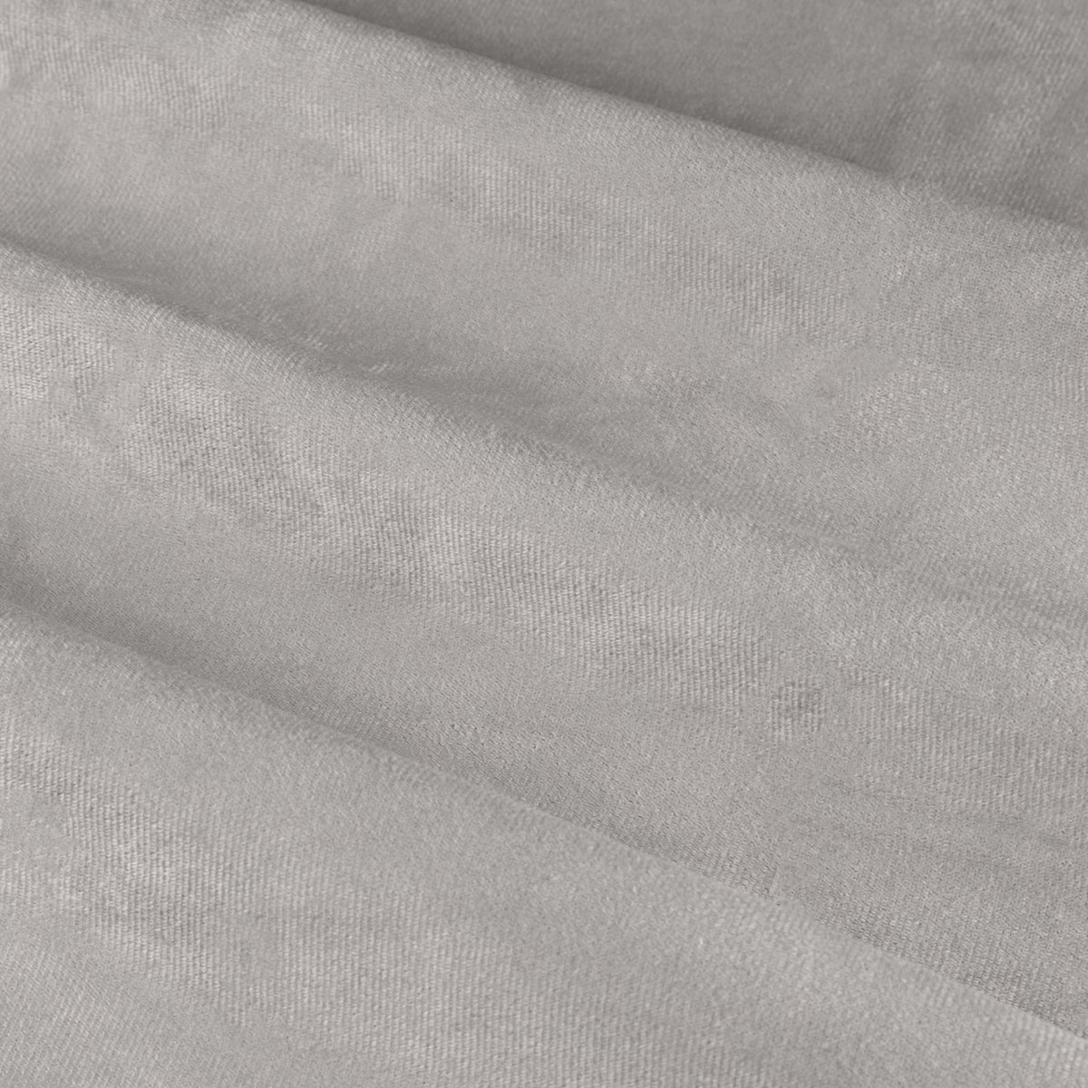 Close-up of The Ultimate Velvet Plain Lined Eyelet Curtains in silver-grey, showing soft matt velvet fabric folds with light catching the pile.