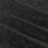 Close-up of The Ultimate Velvet Pencil Pleat Curtains in black, showing the soft matte velvet pile and folded fabric texture of the 100% polyester material.