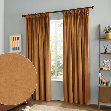 Caramel velvet pencil pleat curtains with pinch-pleat heading on a dark pole, shown in a grey-walled living room beside a shelving unit, with a fabric swatch detail inset.
