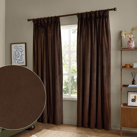Chocolate brown velvet pencil pleat curtains with pinch-pleat heading, hung on a dark rod in a living room window, shown with a fabric swatch inset.