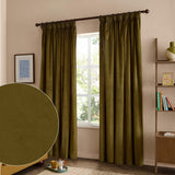 Olive green velvet pencil pleat curtains hanging by a window on a dark rod, with a fabric swatch inset shown in a living room setting.