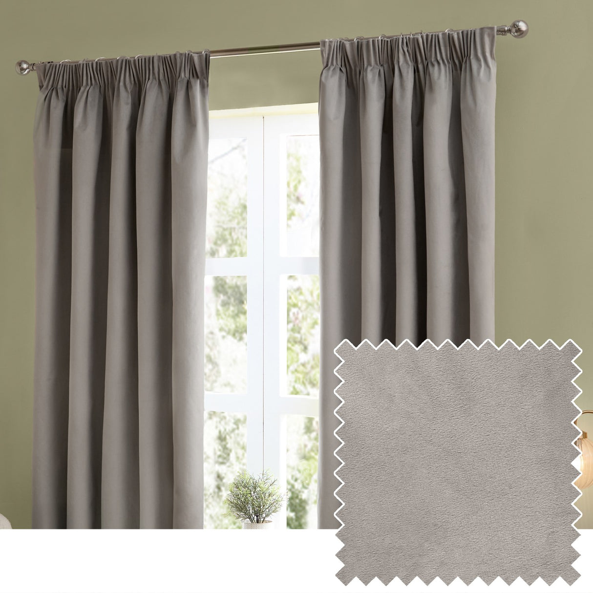 Silver-grey velvet pencil pleat curtains hanging in deep folds on a chrome pole in a living room, with a matching fabric swatch shown alongside.