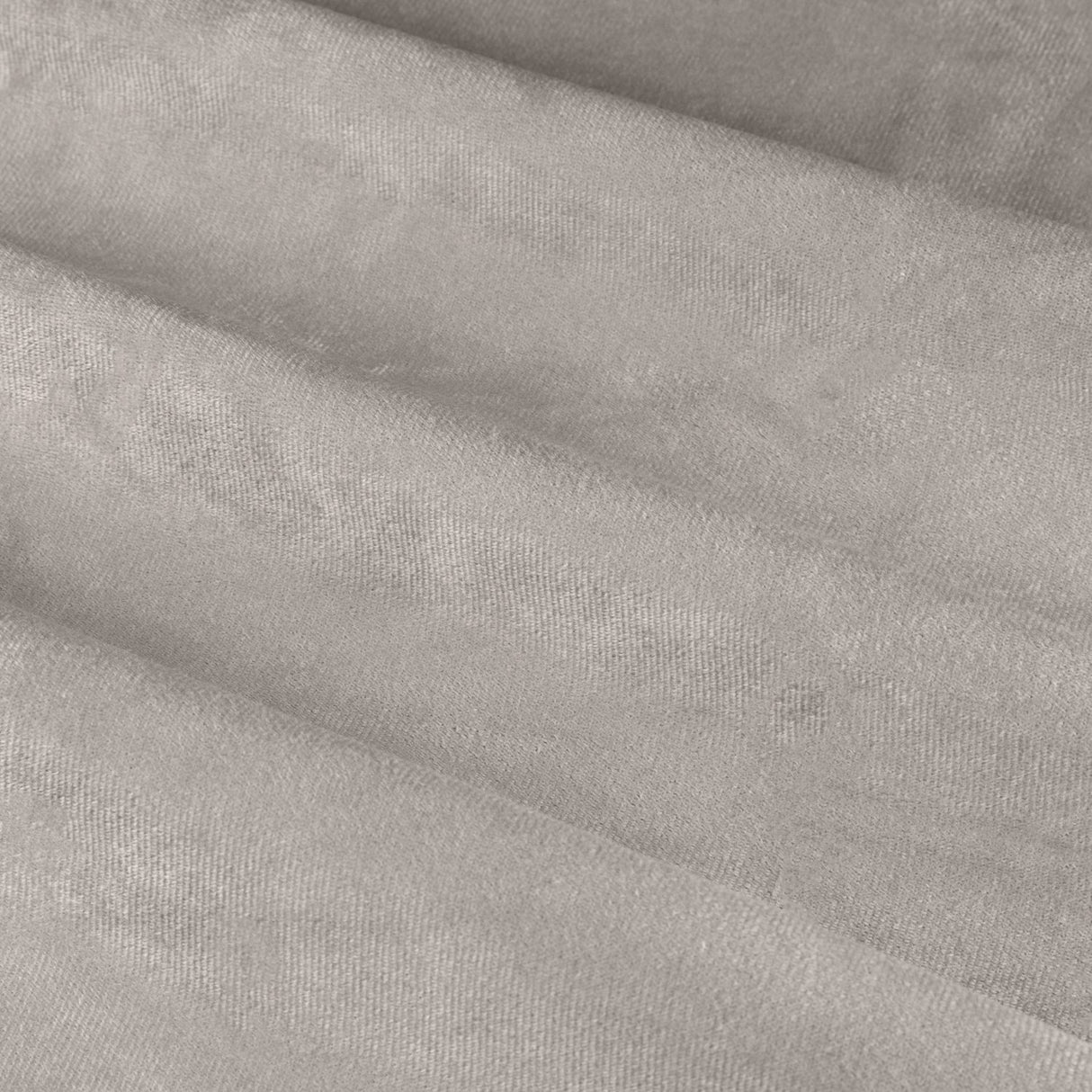 Close-up of The Ultimate Velvet Pencil Pleat Curtains in silver-grey, showing soft matte velvet fabric with deep folds and a subtle sheen.