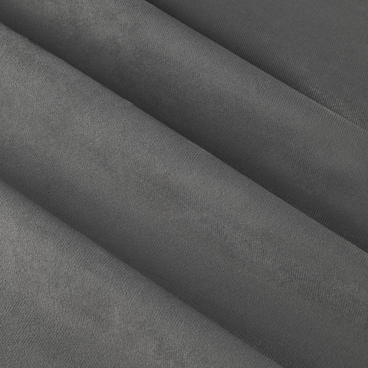 Close-up of The Ultimate Velvet Plain Lined Eyelet Curtains in charcoal, showing soft, smooth velvet fabric with deep folds and a matt finish.