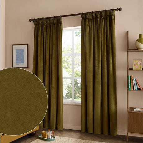 Olive green velvet pencil pleat curtains with pinch-pleat heading on a dark rod, shown hanging in a living room beside a window, with a fabric texture swatch inset.