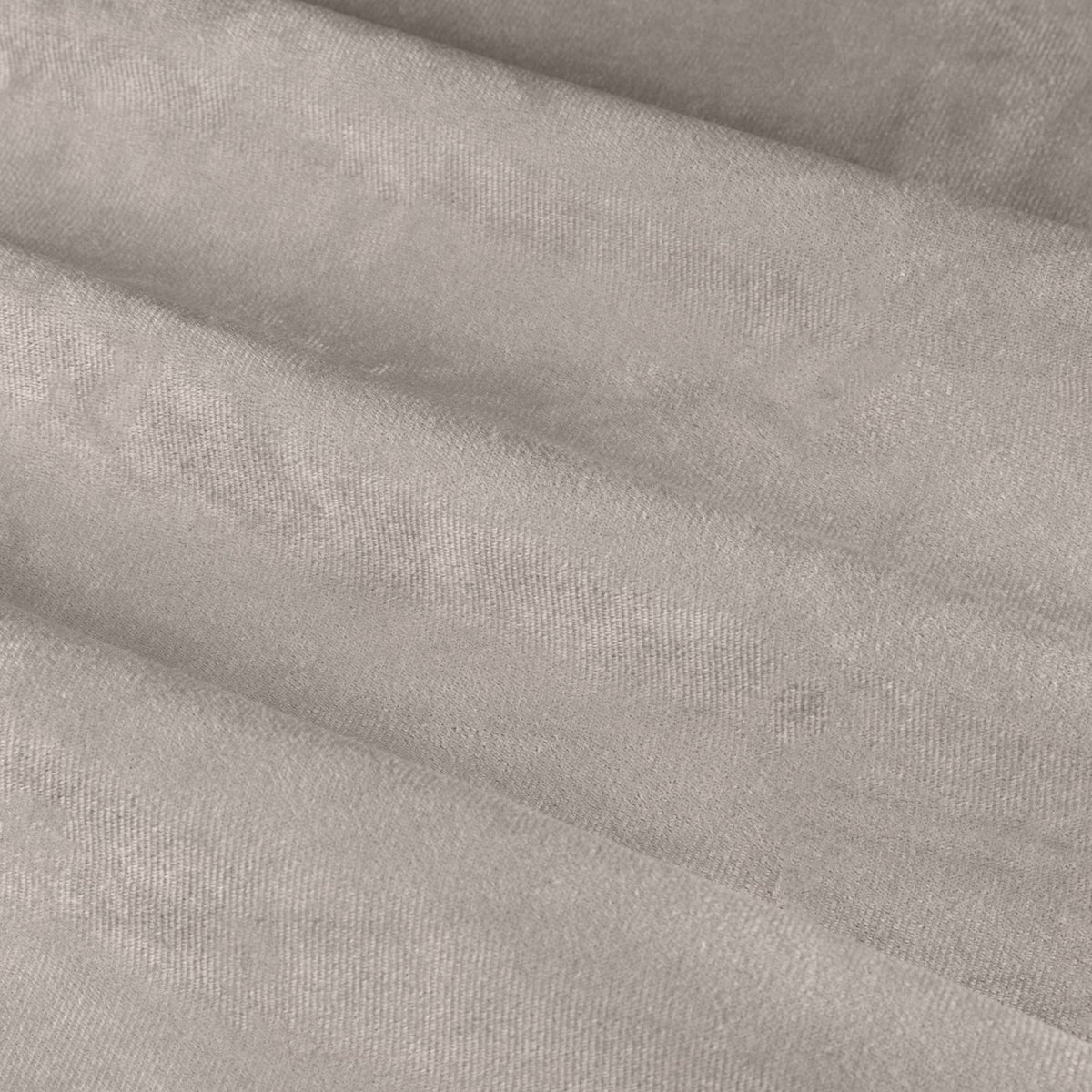 Close-up of The Ultimate Velvet Pencil Pleat Curtains in silver-grey, showing soft folds and a matt velvet-finish polyester fabric texture.