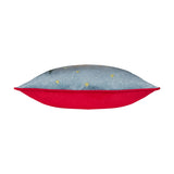 Side view of the Ditsy Festive Reindeer velvet cushion, showing slate-blue front with embroidered gold stars and a plain red velvet back, on a white background.