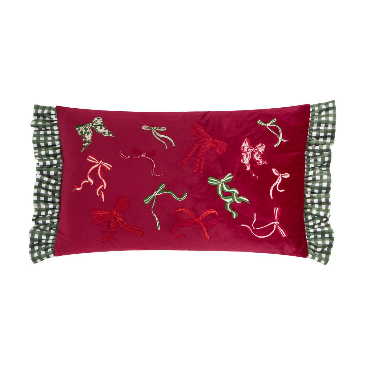 Ditsy Bows rectangular velvet cushion in deep red with embroidered bow designs in red, green and cream, edged with green and white gingham ruffles, shown on a white background.